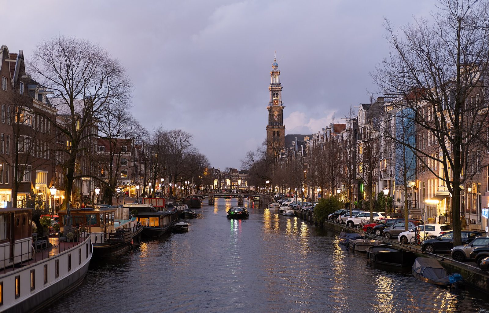 Prinsengracht canal and the Westerkerk tower, a classic first stop on one day in Amsterdam with friends